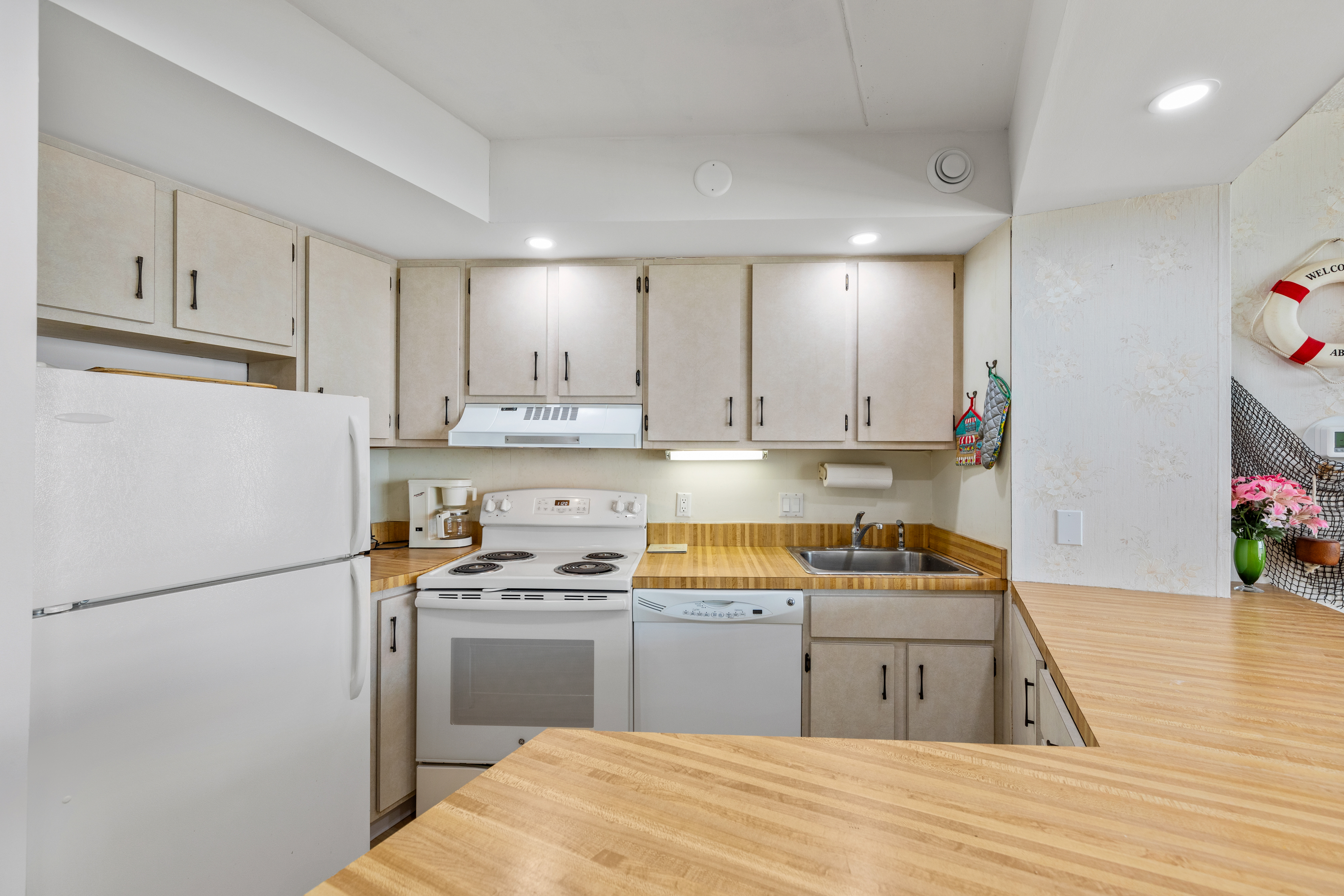 The open kitchen lets everyone continue to enjoy family time.