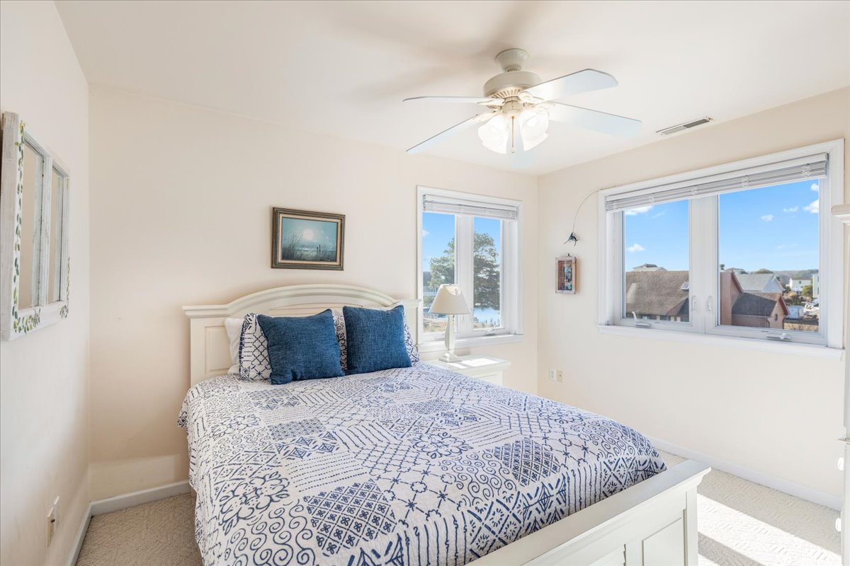 Bedroom 2 is dressed in Nautical Navy and Crisp White.