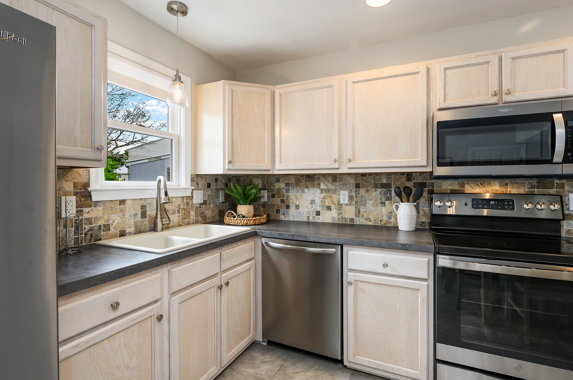 The kitchen offers plenty of space for bringing together your family's favorite meals