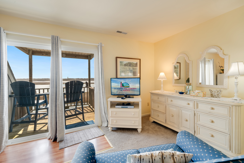 Flat Screen TV and Private Balcony in Bedroom 3.