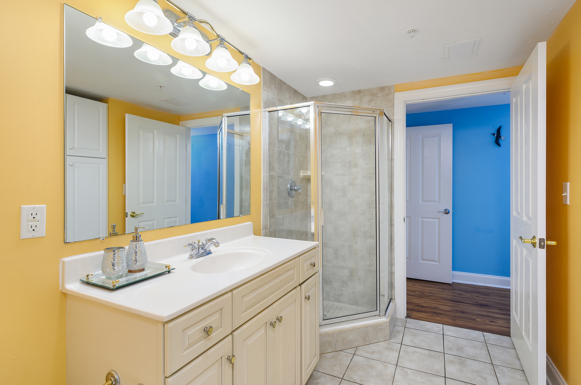 The shared Jack and Jill bathroom has plenty of counter space and a large Walk-In shower