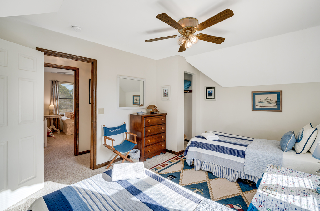 Bedroom 3 is decked out in crisp white and nautical navy.