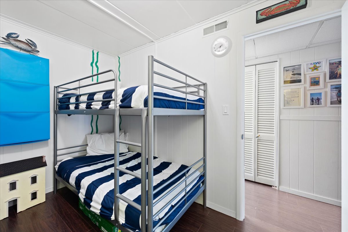 With Nautical Blue Decor, 2 Twin Bunk Beds & a Flat Screen Smart TV.