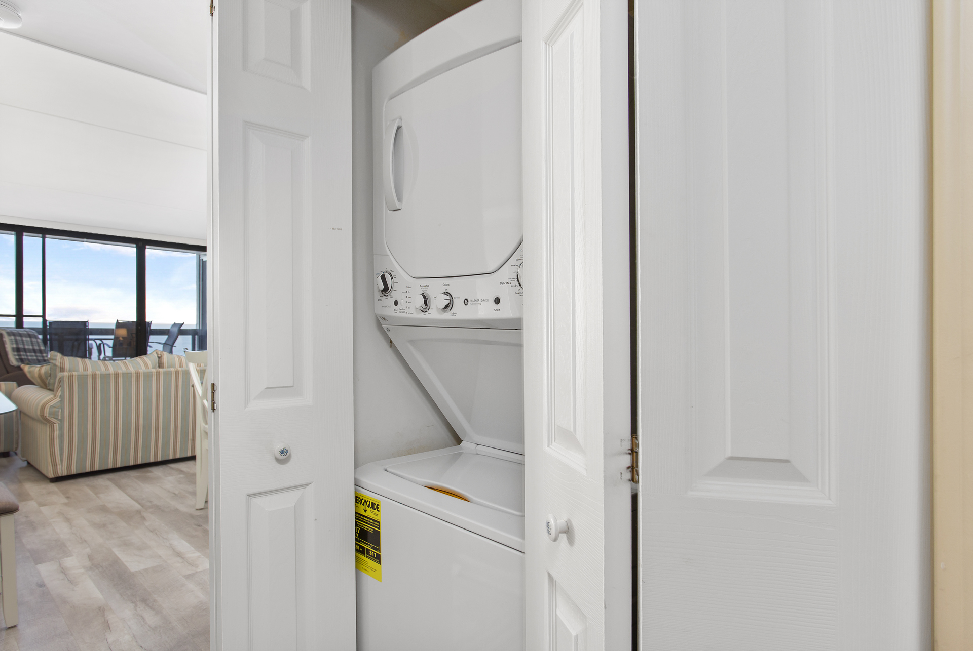 Stacked Washer & Dryer, near the entrance of the home, in case you need to toss in a quick load!