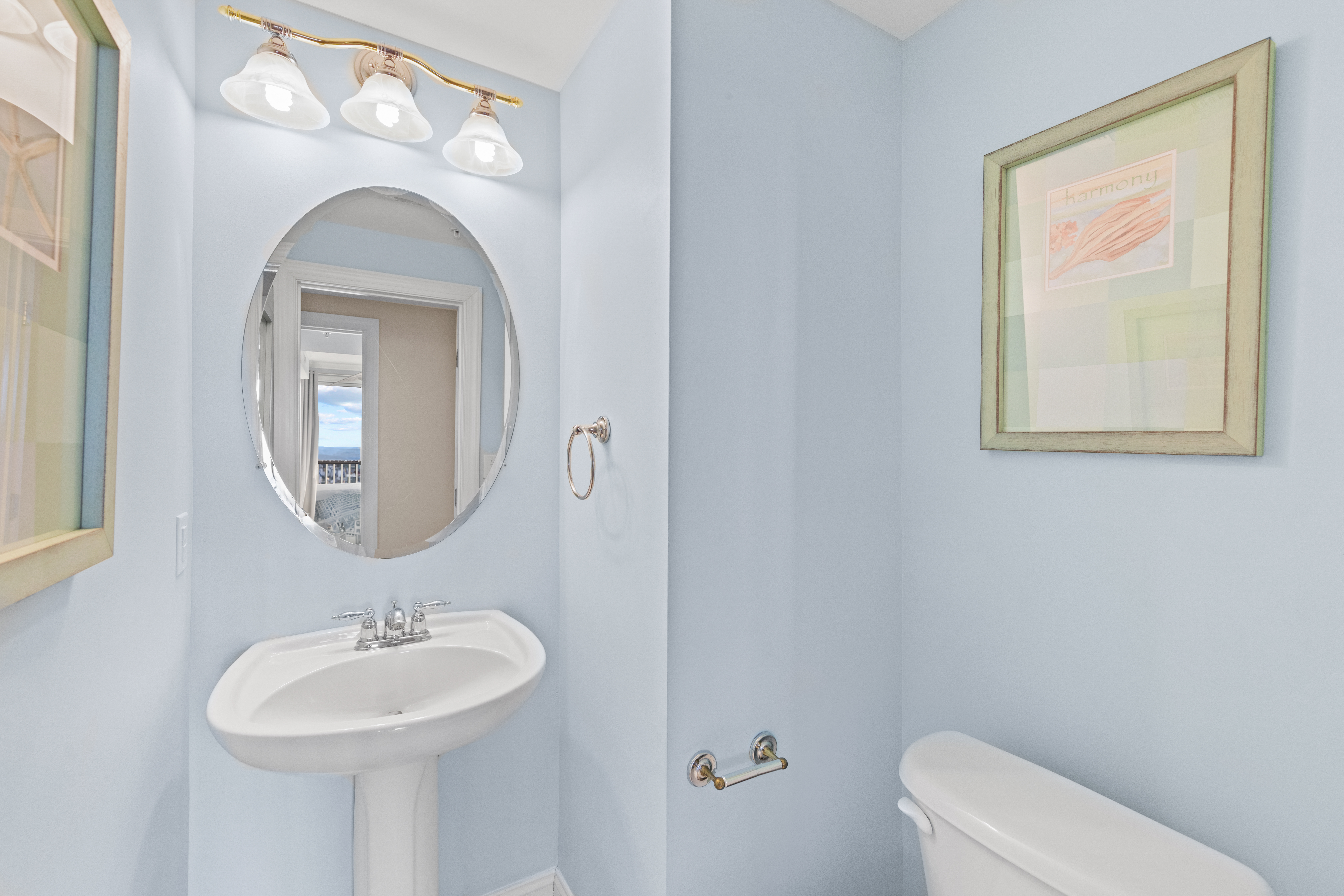 Just off the main Living Area is a convenient Half Bath