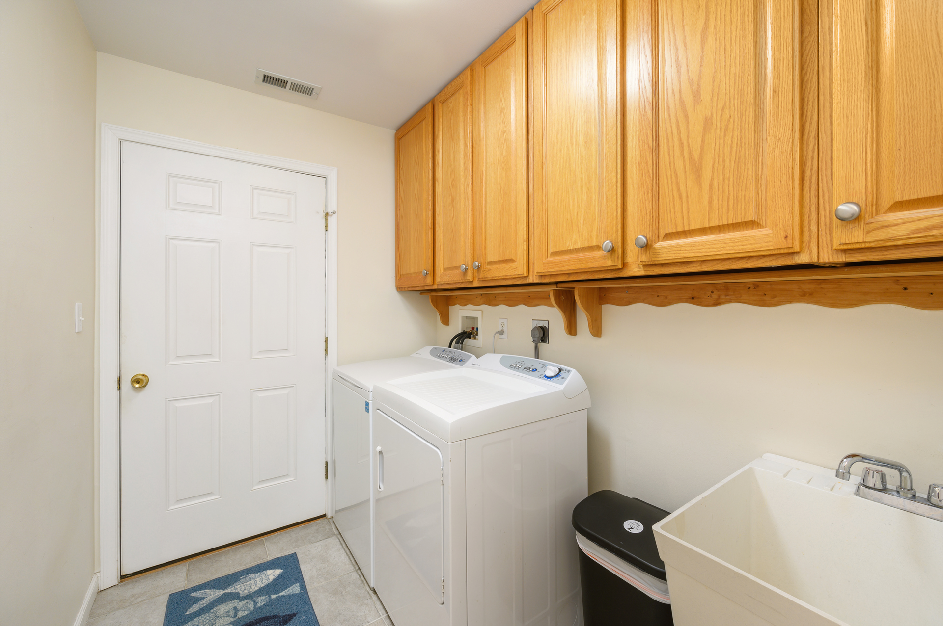 Utility Room houses a full size Washer and Dryer for your convenience.