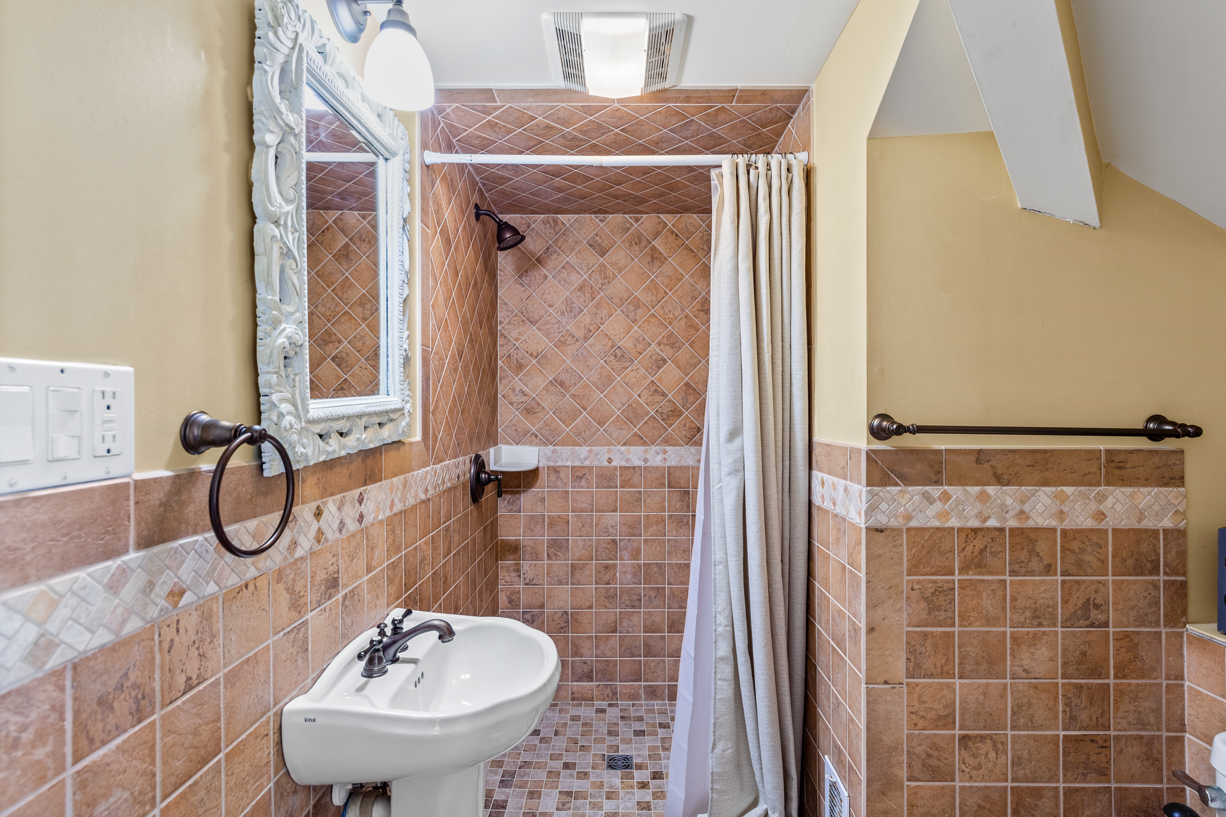 There is also a attached Private Bath with a custom Tile Walk-in Shower.