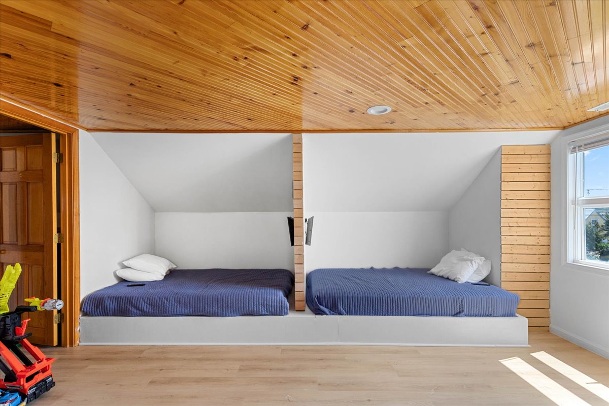 Just off Bedroom 3 is the Kids Area with 2 Full Beds and a Twin Bunkbed.