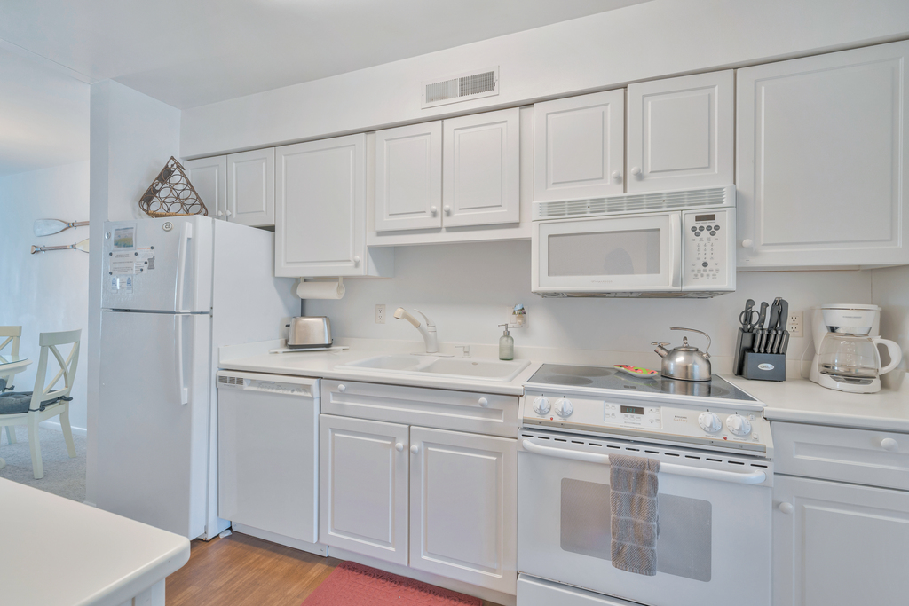 Beachy White Cabinetry and all the bells and whistles.