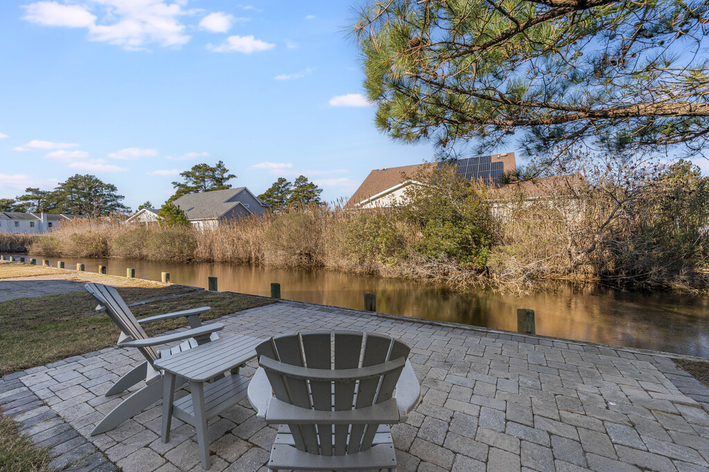 Relax and take in serene Views of the Tidal Pond in the backyard.