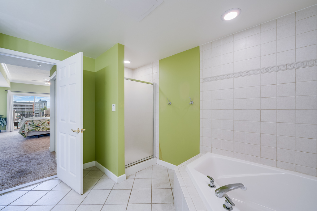 You just might feel like you`re in Paradise in the Tropical Themed Primary Bath.