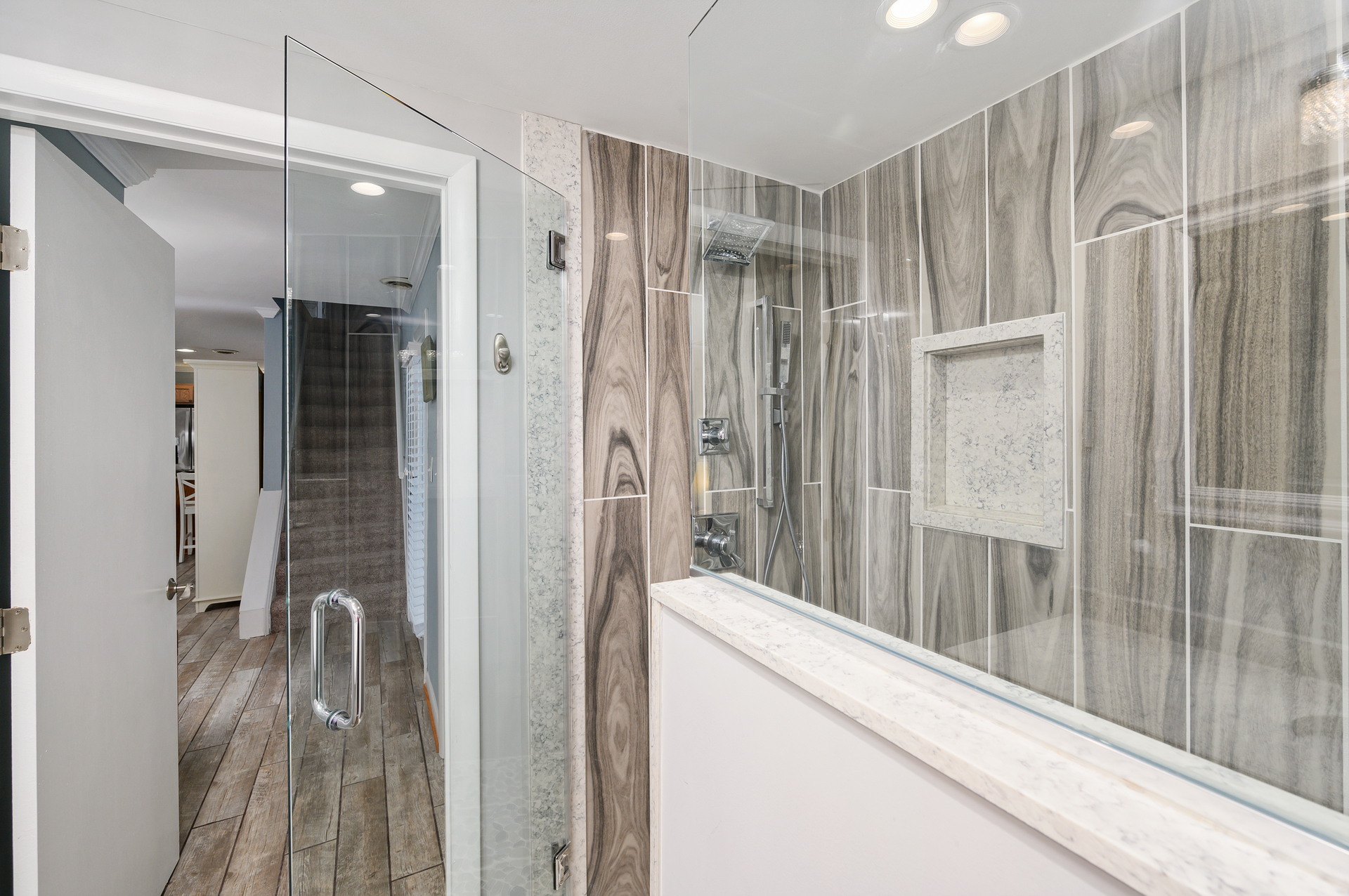 This bathroom is nothing short of a spa-like retreat with a spacious glass walk-in shower.