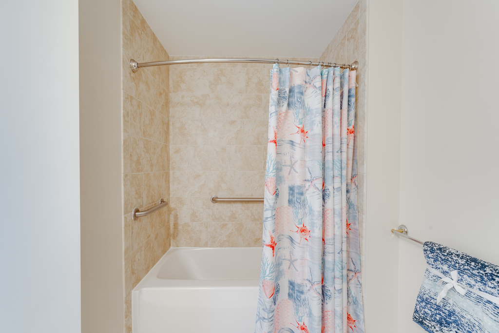 Shared full bath features Shower/Tub Combo.