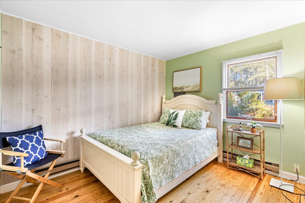 Bedroom 2 has Sea Grass Greens and a Full Bed.