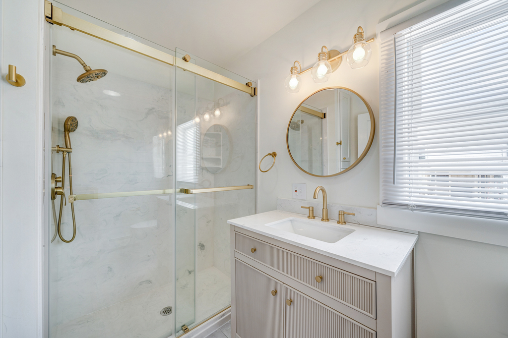 Full Bath 1 is on the 1st Floor and features a Custom Walk-in Shower.