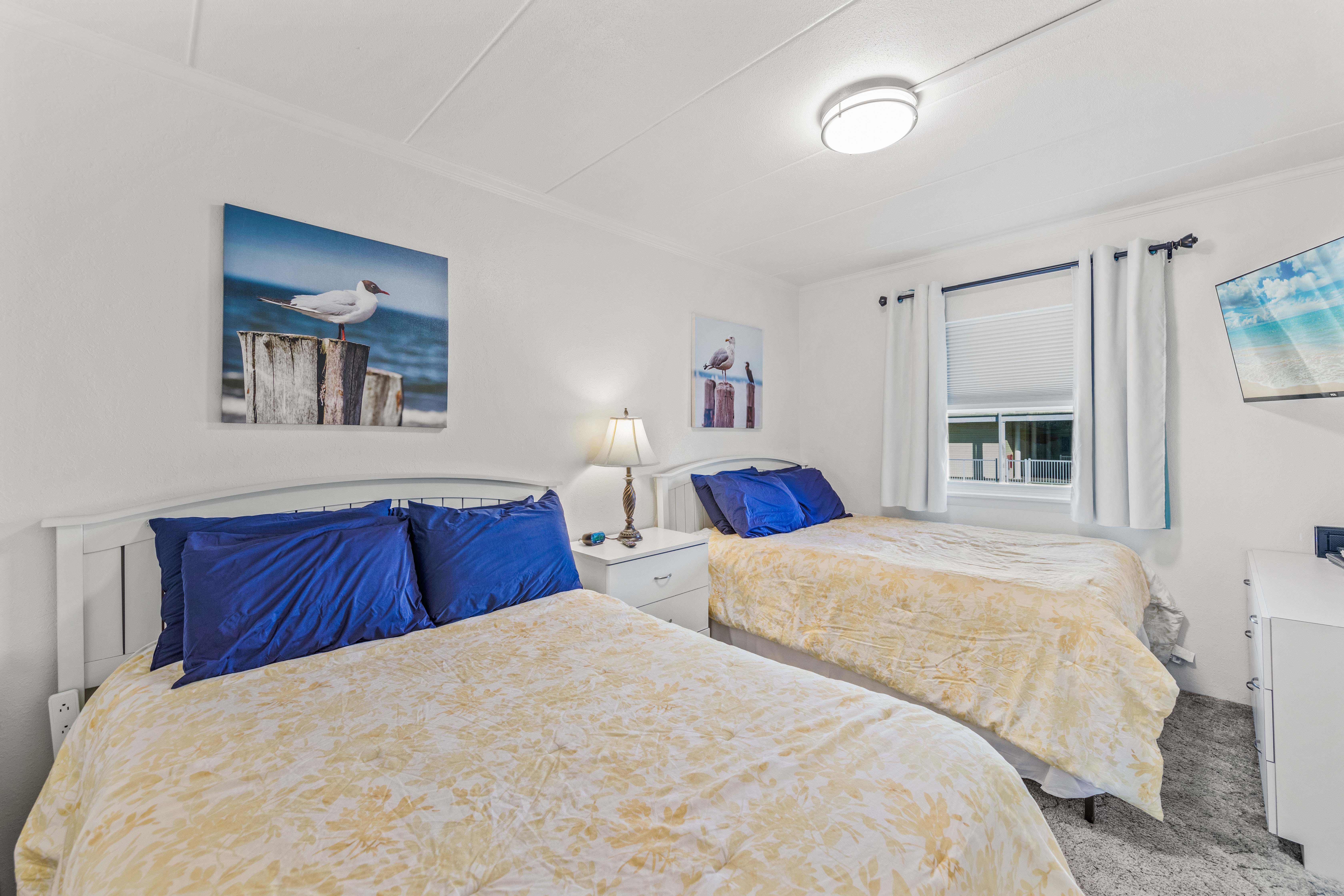 Bedroom 2 features 2 Full Size Beds, sleeping up to 4 people.