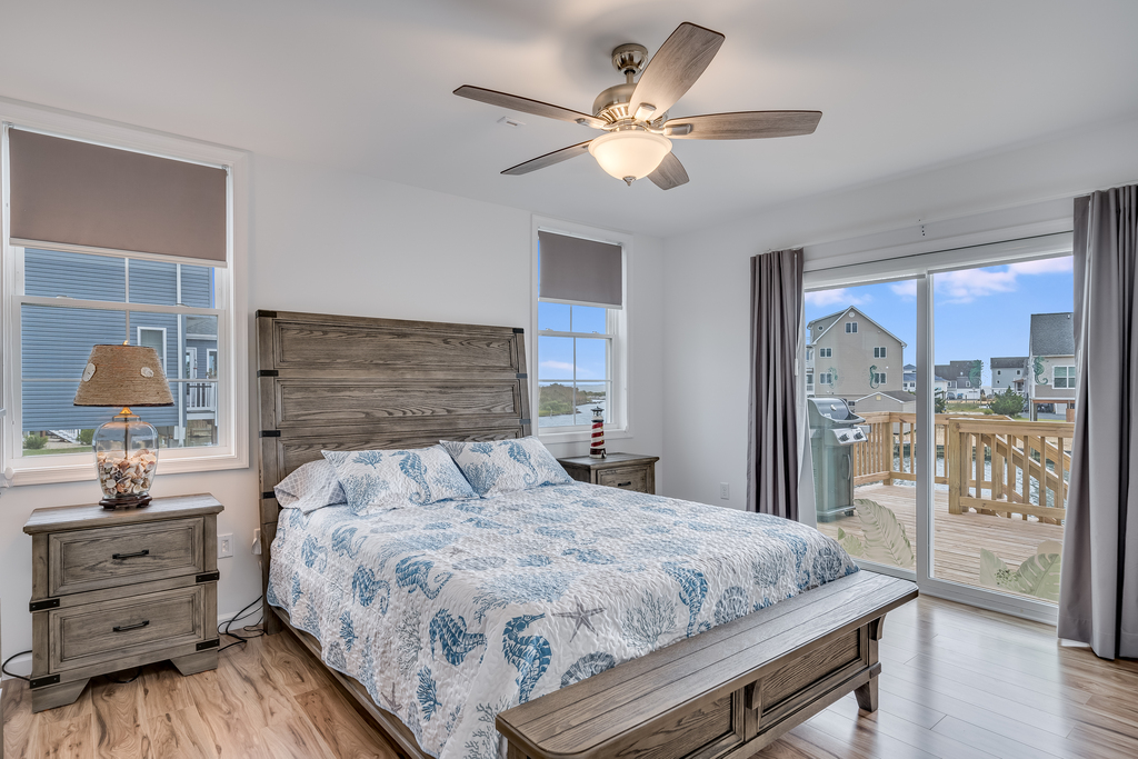 Gorgeous Primary Bedroom with comfy Queen Bed and Bay Views.