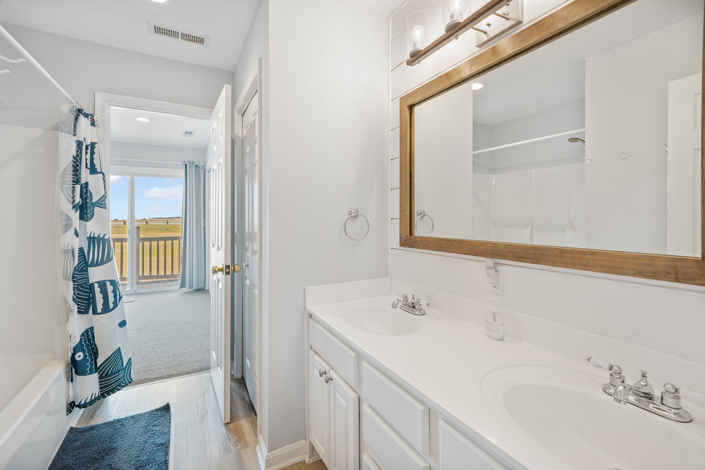 The Primary Full Bath is attached, and has a double vanity and tub/shower combo.