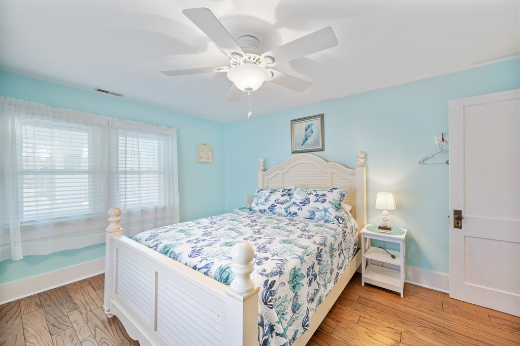 Bedroom 1 has a comfy Queen Bed and beachy beautiful bedding.