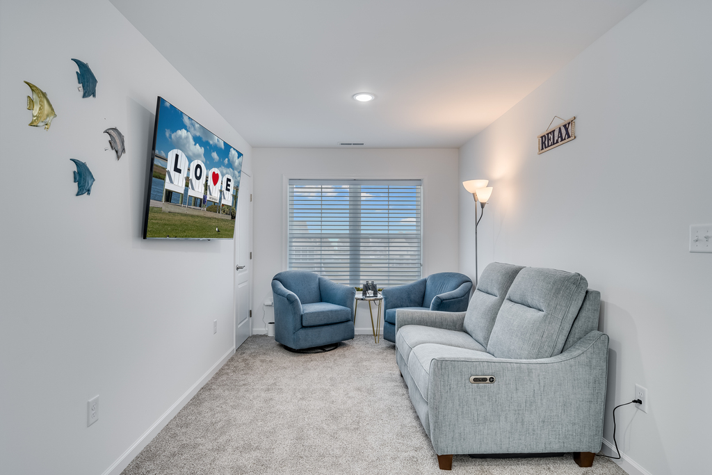 Wandering upstairs, you'll find a cozy Family Room with Flat Screen Streaming TV.