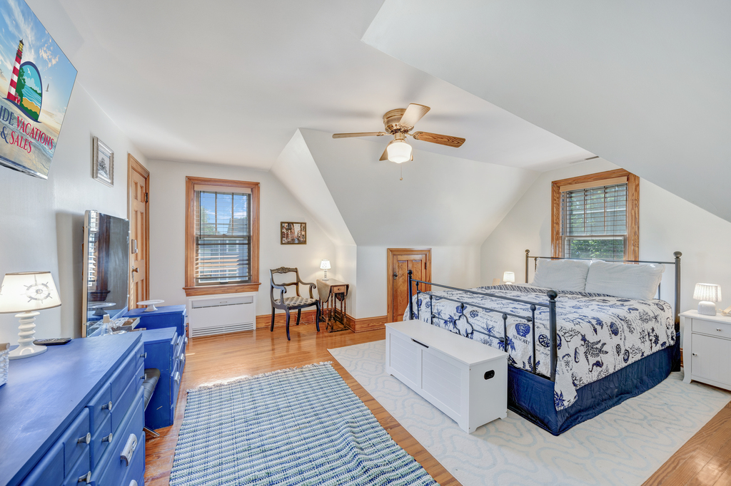 Bedroom 2 has another Full Bed and is dressed in crisp white and nautical navy.