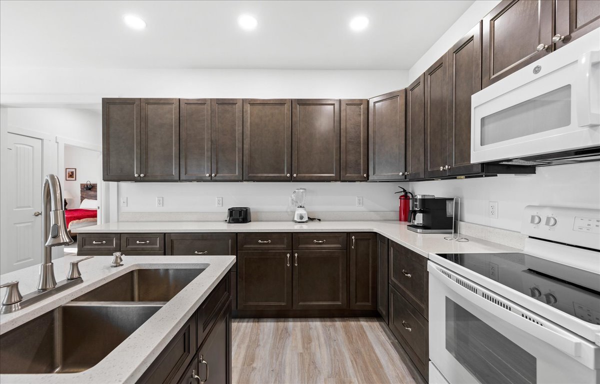 Warm Wood Cabinetry and tons of Countertop Space.