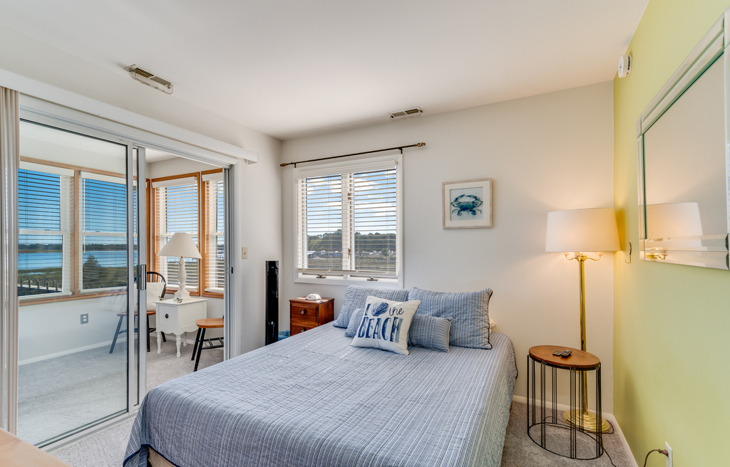 Bedroom 2 is on the water side of the home and has a comfy Queen Bed.