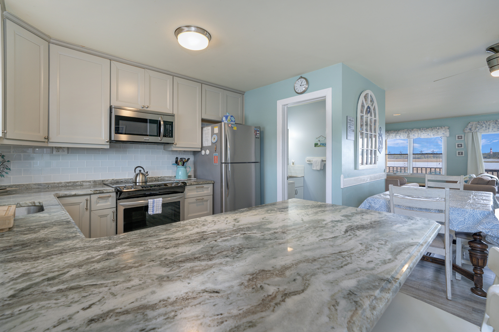 Solid Surface Countertops and Stainless Appliances.