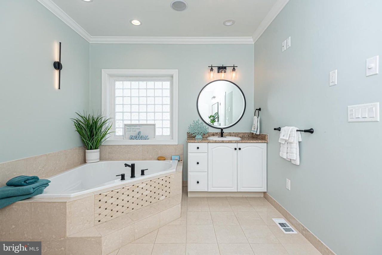 Full Bath attached to Bedroom 1 offers a Large Soaking Tub.