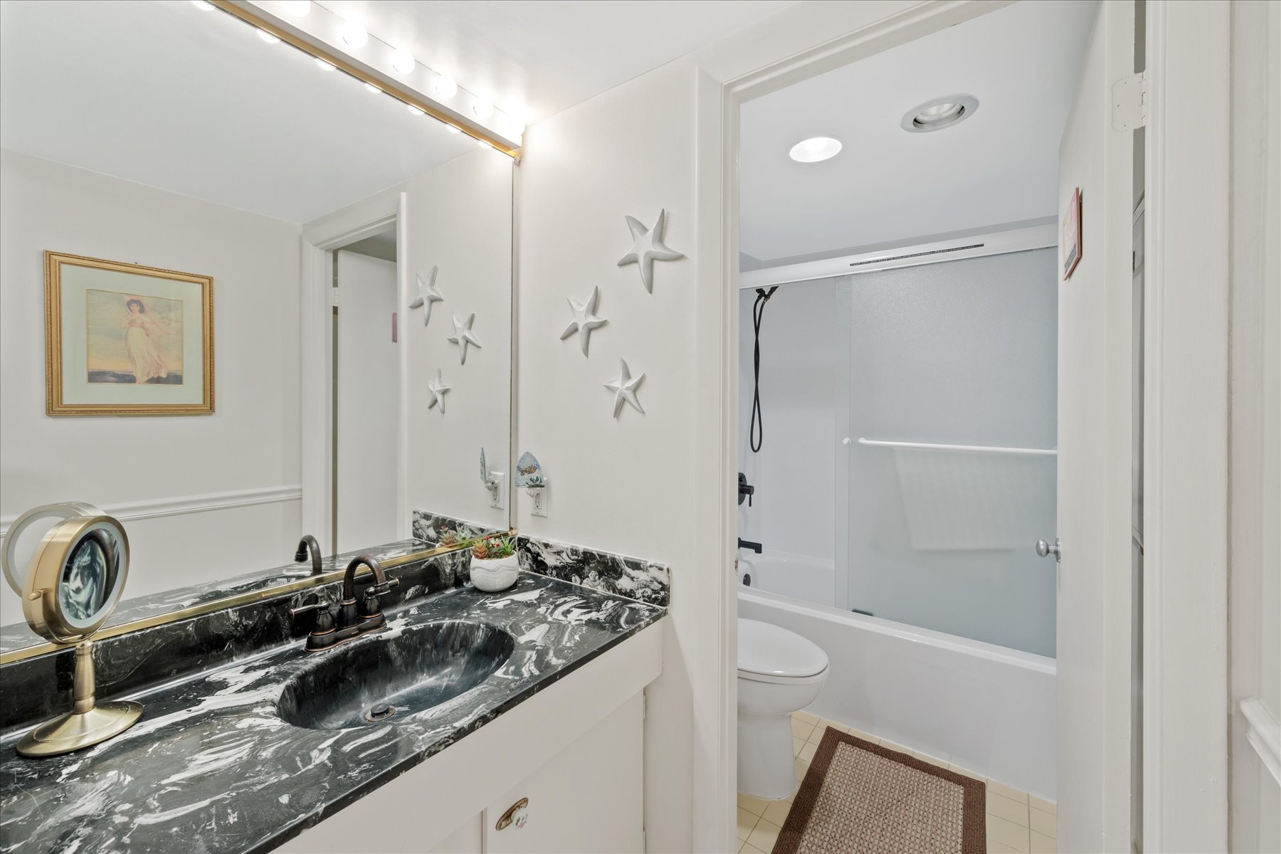 The Shared Full Bath is convenient to the Bedrooms and the Living Area