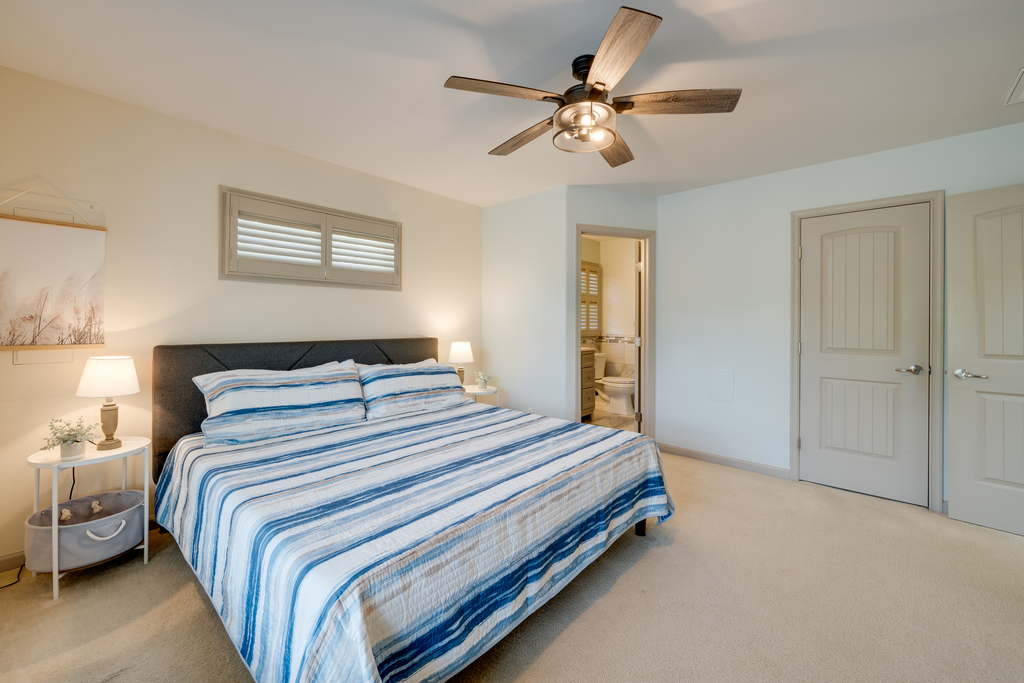 Bedroom 1 is adorned in colors of sand and sea.
