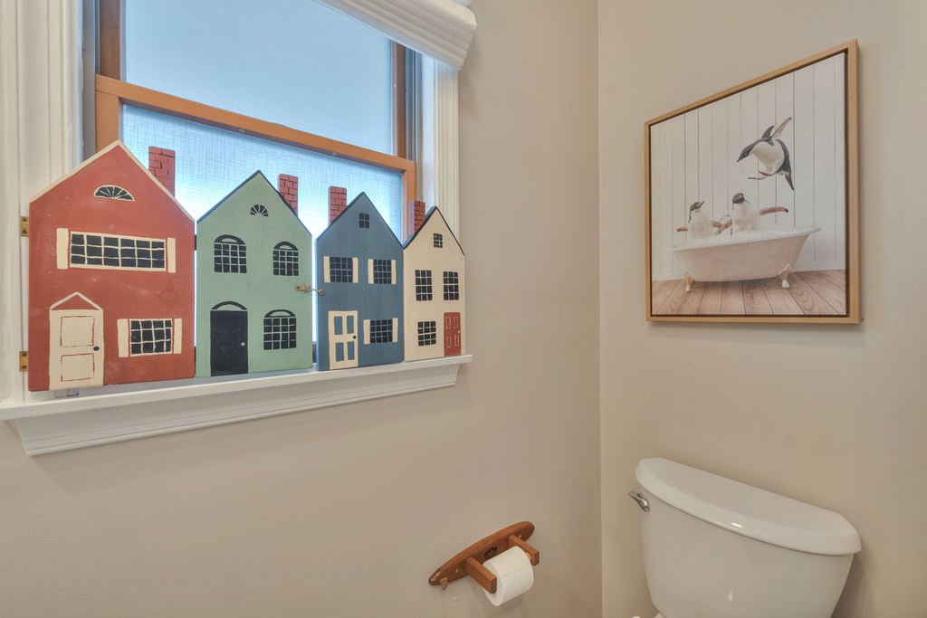 Convenient Half Bath off the Kitchen and Living Area.