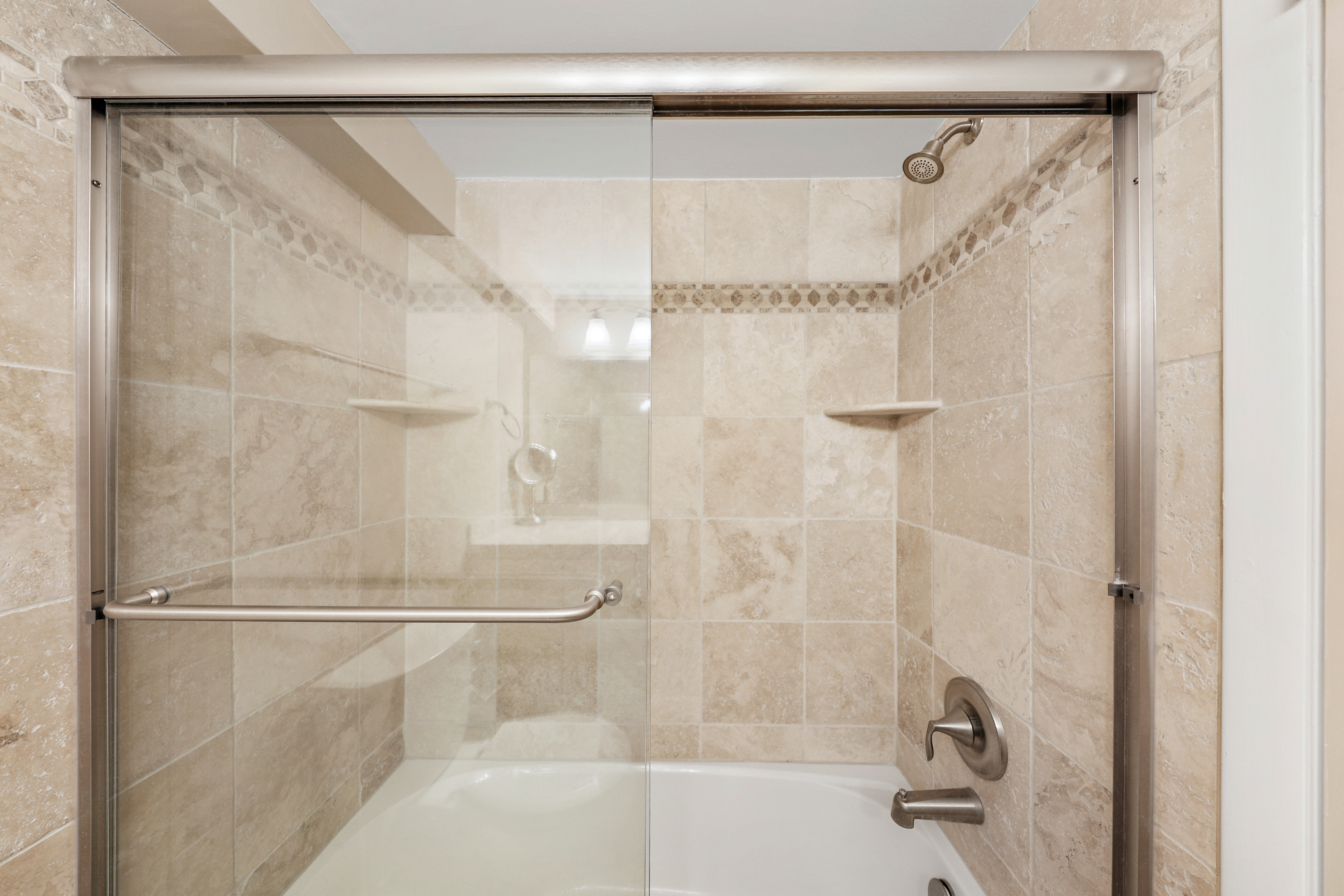 Featuring a custom tile Tub/Shower Combo.