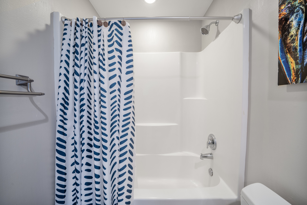Features a Shower/Tub combo.