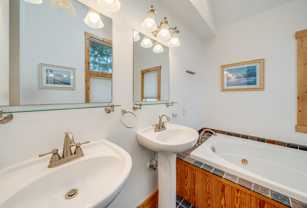 Attached Full Bath 3 is spa-like with a Soaking Tub and Walk-in Shower.
