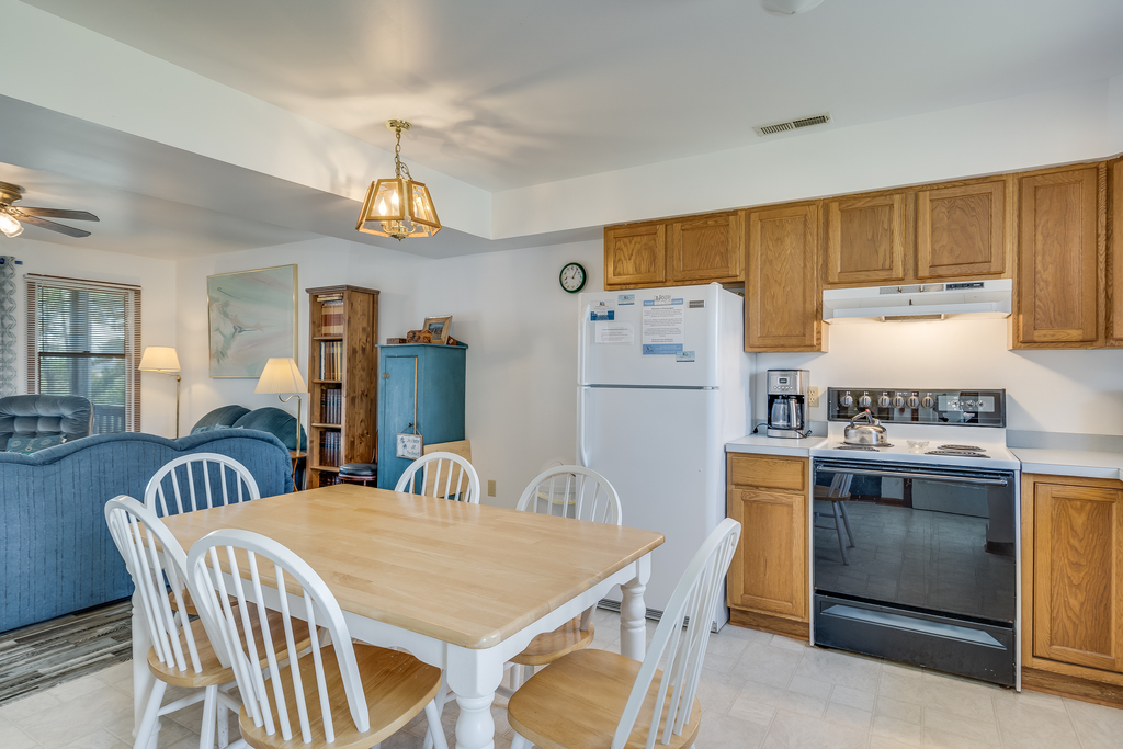 Living Area leads to Open Kitchen and Dining Area.