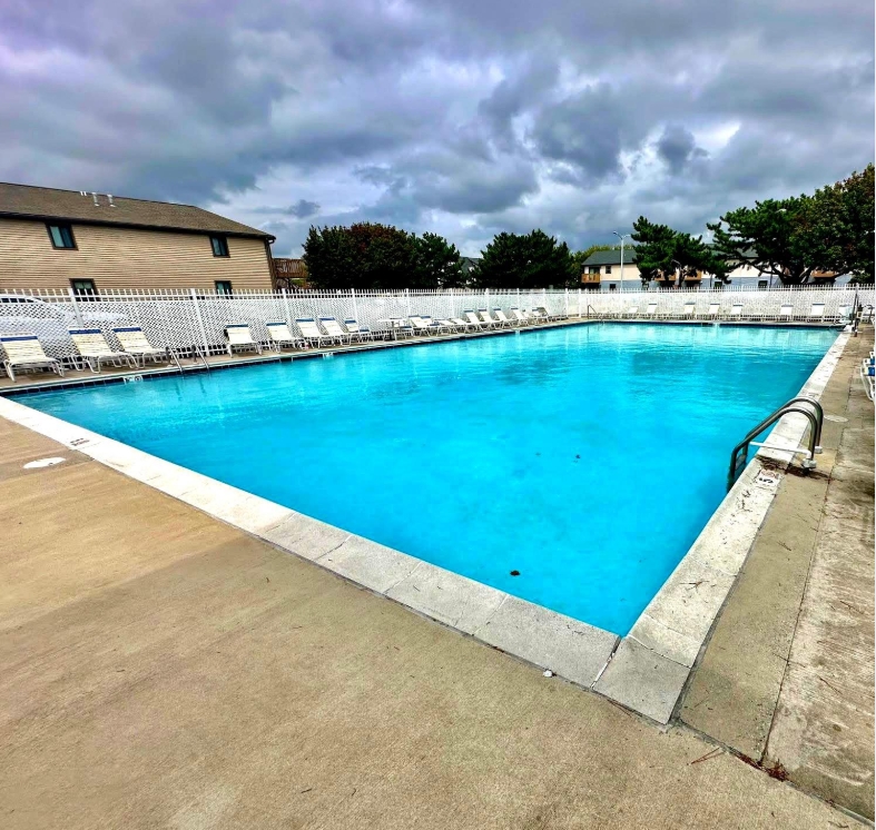 Take a refreshing dip or work on your vacation tan at the large communal outdoor swimming pool.