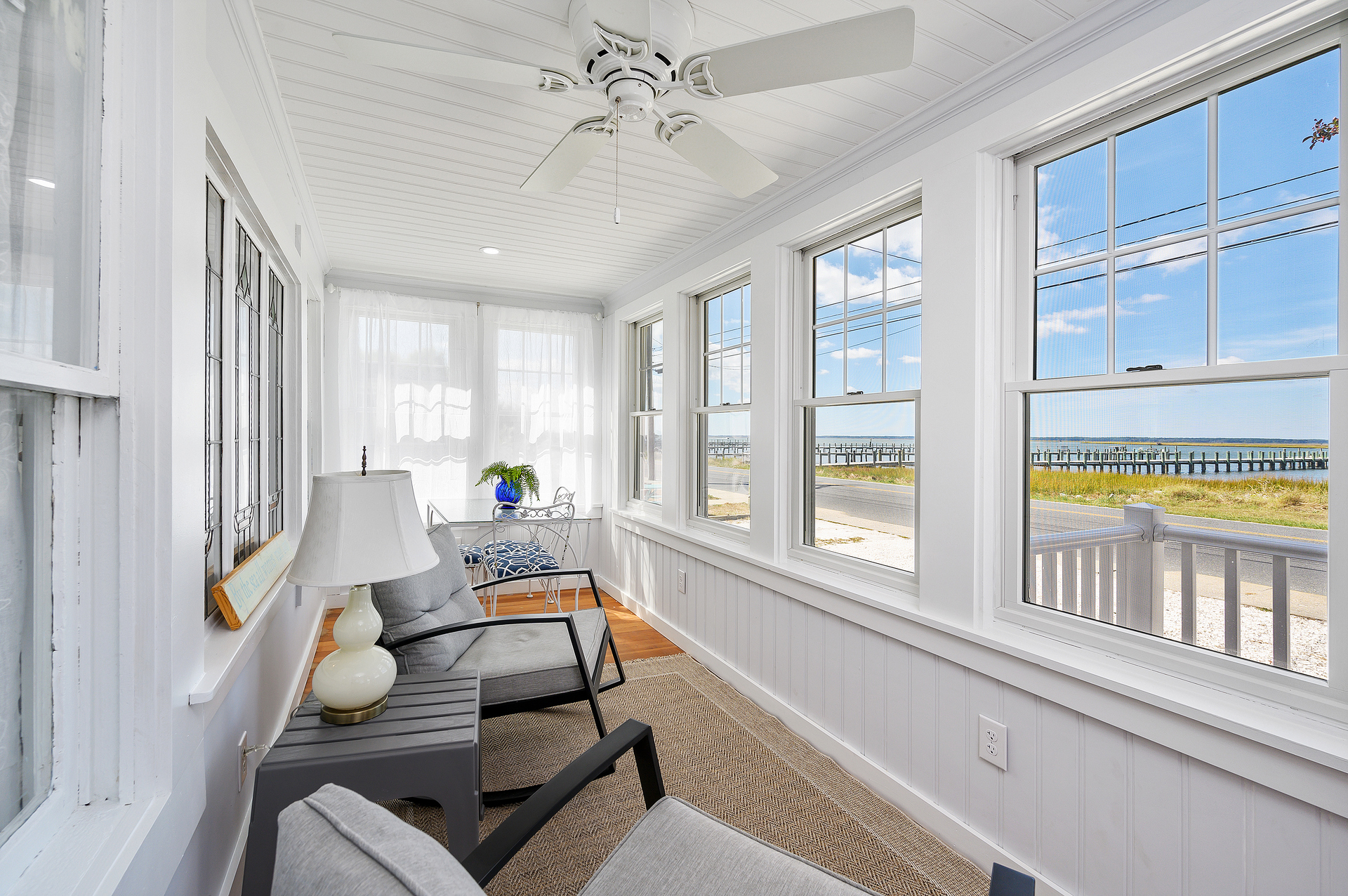 Cozy Front Porch faces the Chincoteague Bay.