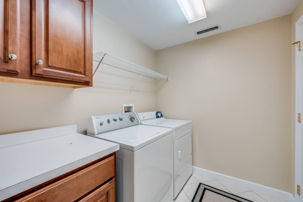 Spacious Laundry Room with Top-of-the-line Washer & Dryer.