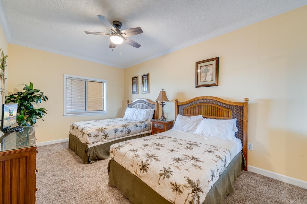 Bedroom 2 has 2 Full Beds and Luxurious Tropical Bedding.
