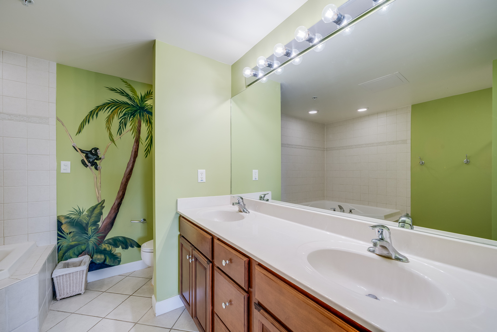 You just might feel like you`re in Paradise in the Tropical Themed Primary Bath.