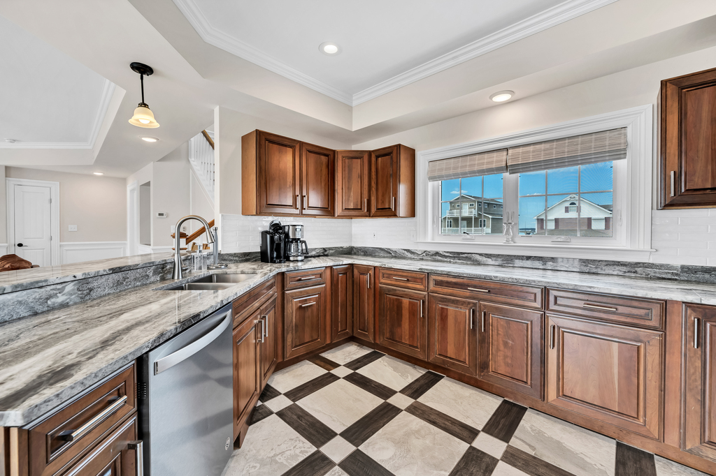 Awesome Tile, Gleaming Granite, & Stainless Appliances.