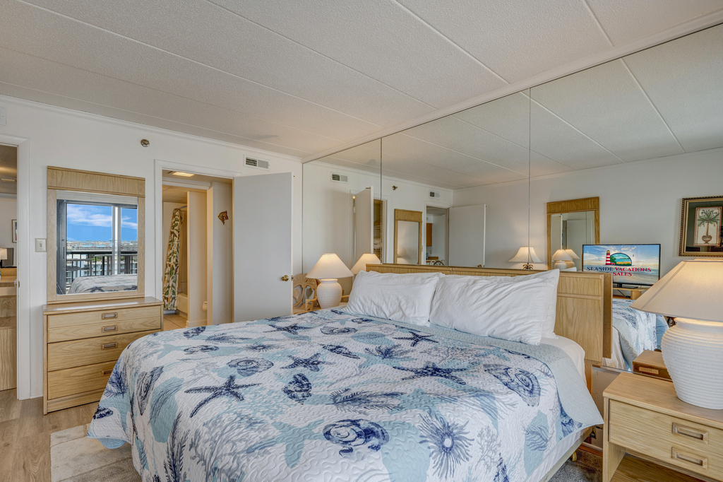 Fall into your cozy king size bed in the Primary Bedroom after a long day at the beach or pool.