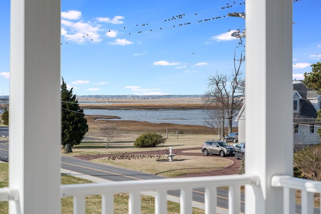Enjoy of glass of wine on the Primary Bedroom Deck while watching one of our famous Chincoteague Sunsets.