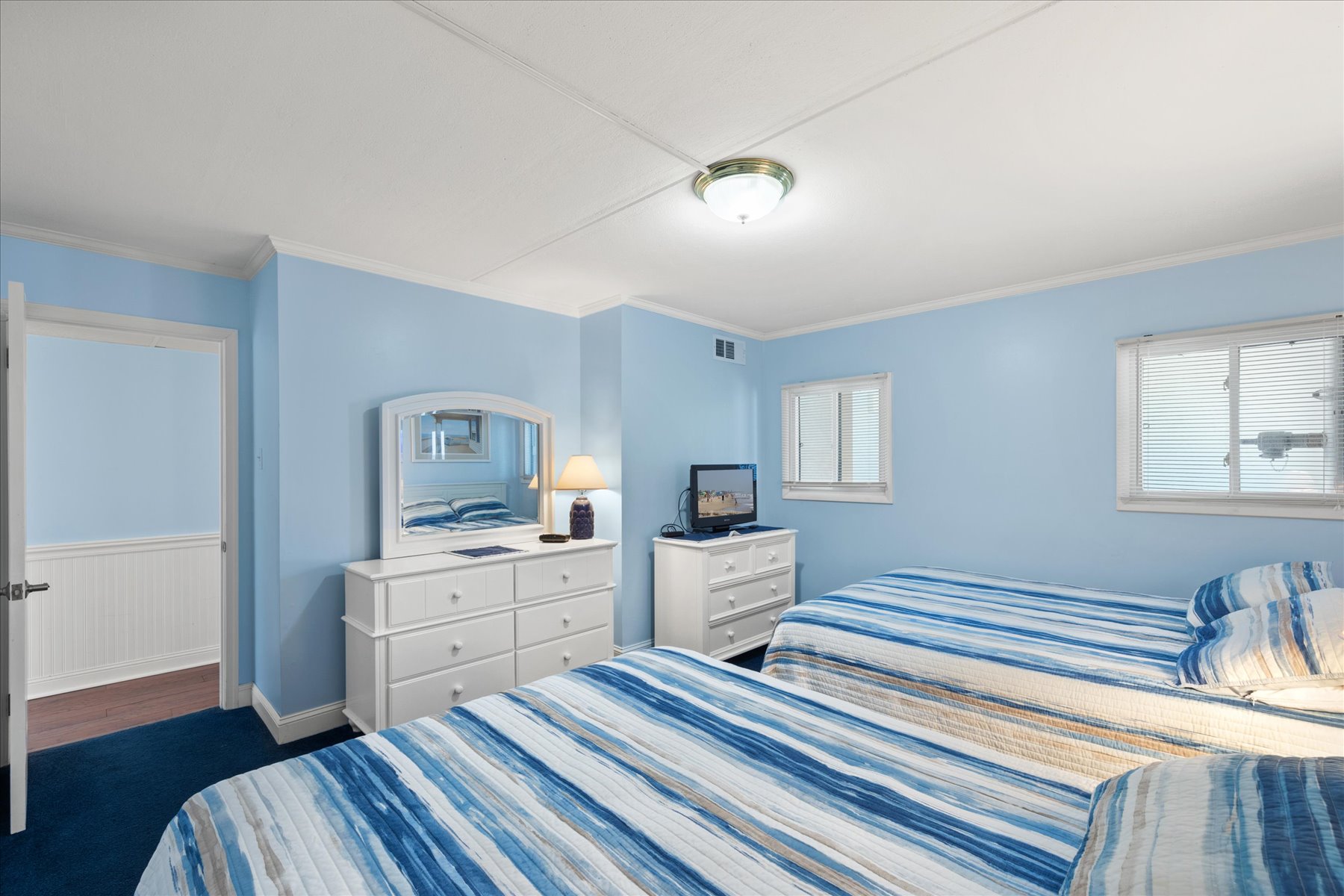 Unwind with the Flat Screen TV after a Beach day.