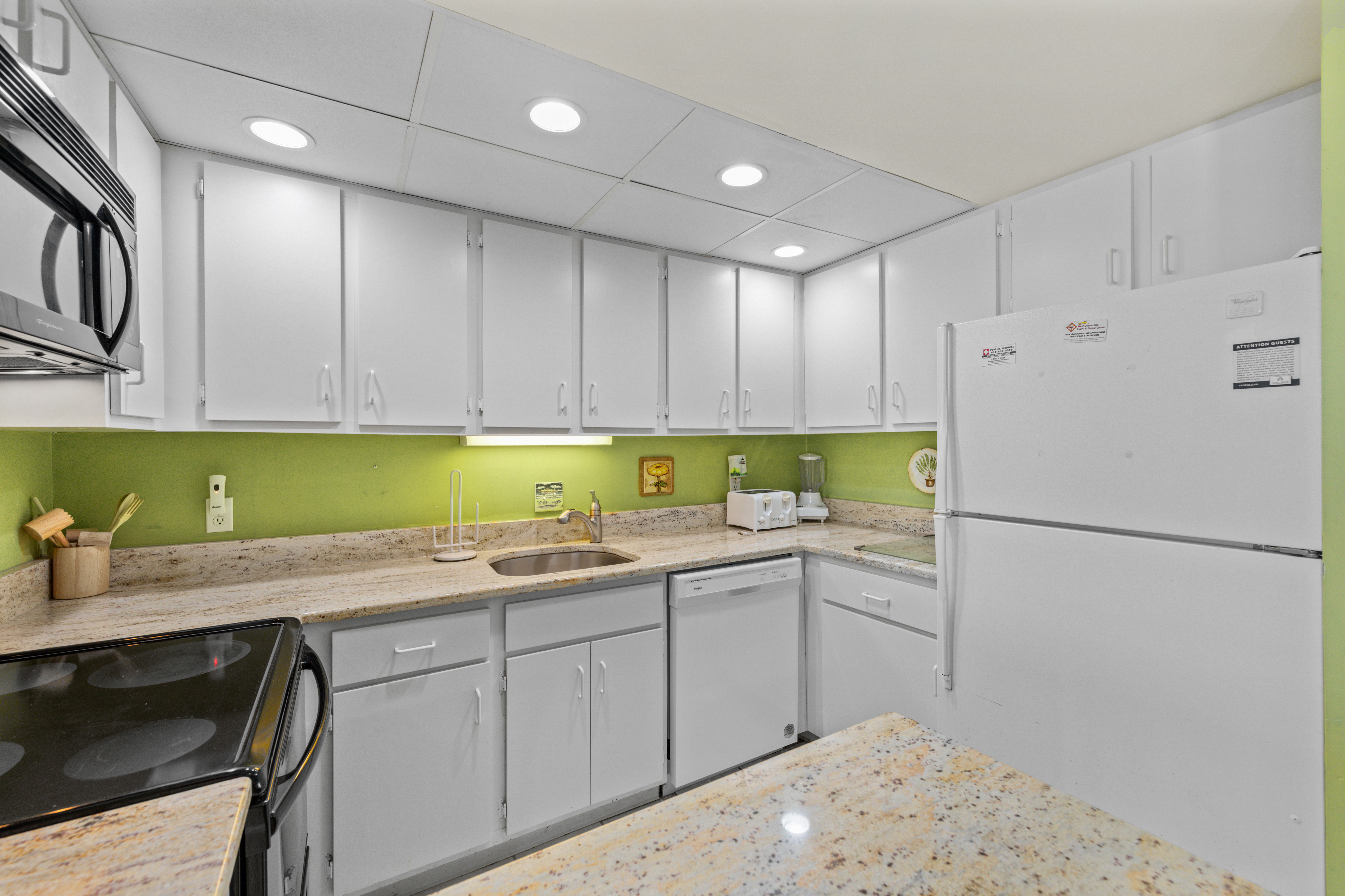 The Bright White and Open Kitchen will WOW the Chef in your Family.