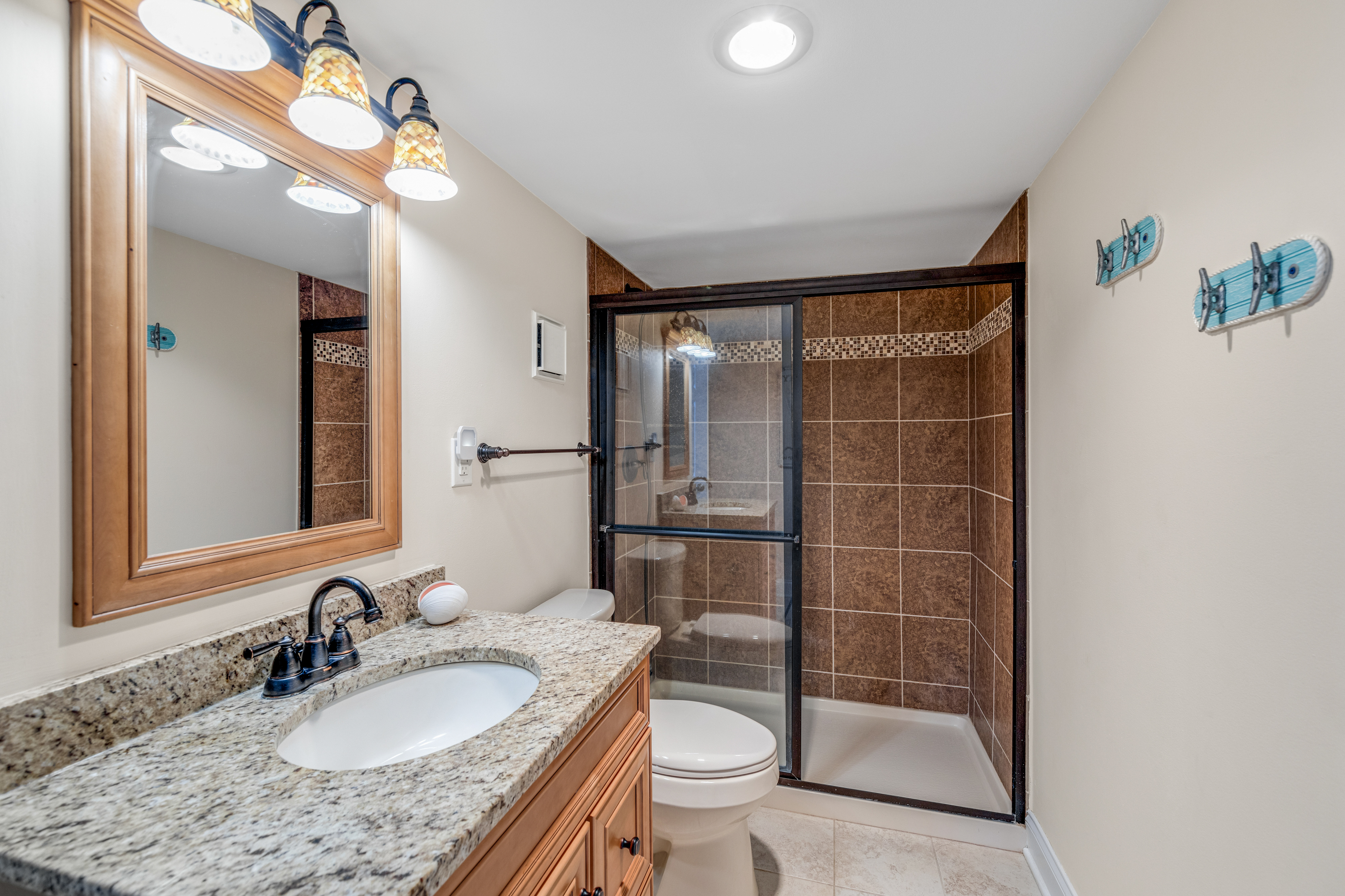 Gorgeous Full Bath with Walk-in Shower convenient to Bedrooms and Living Area.