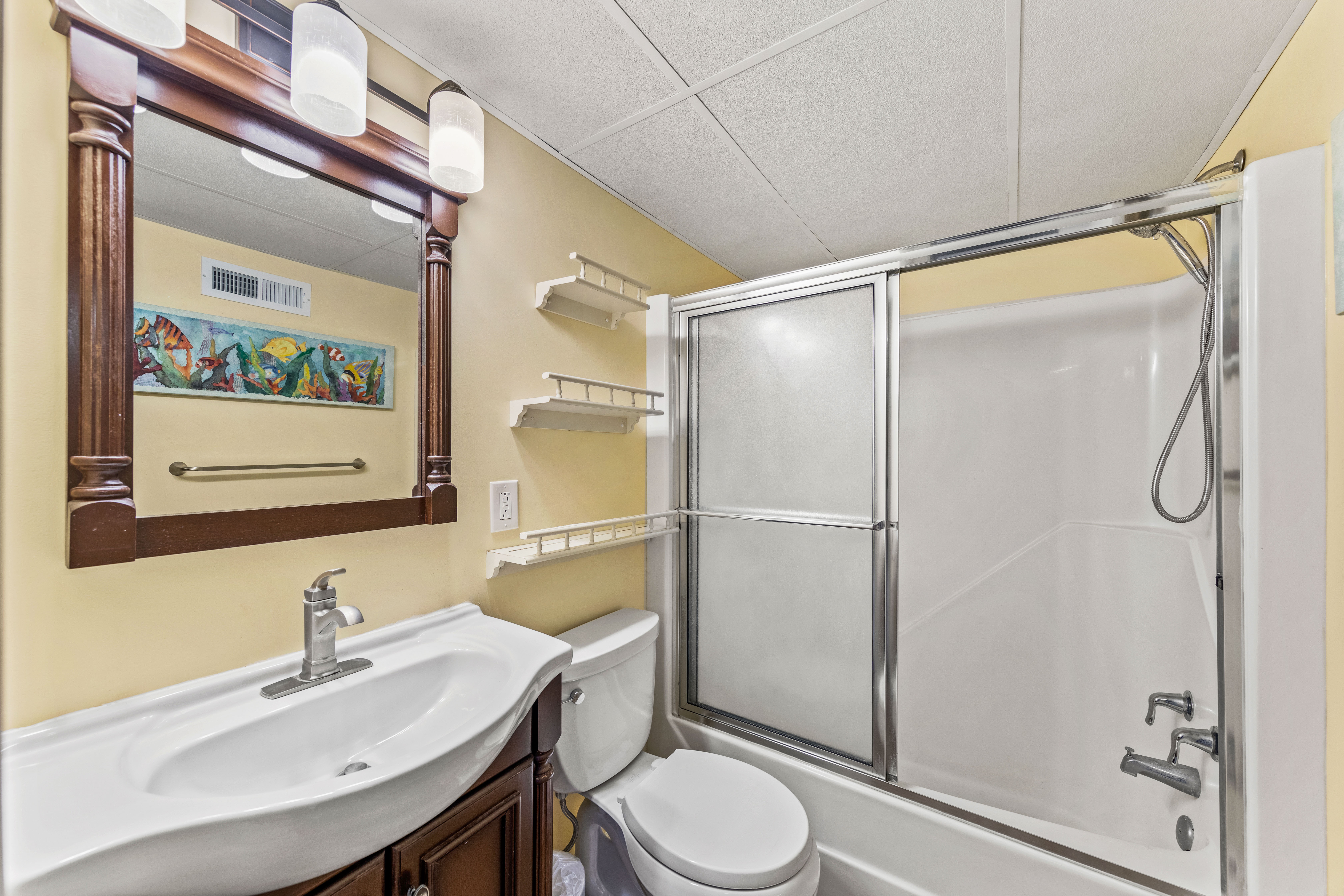 Shared Full Size Bath with shower/tub combo.