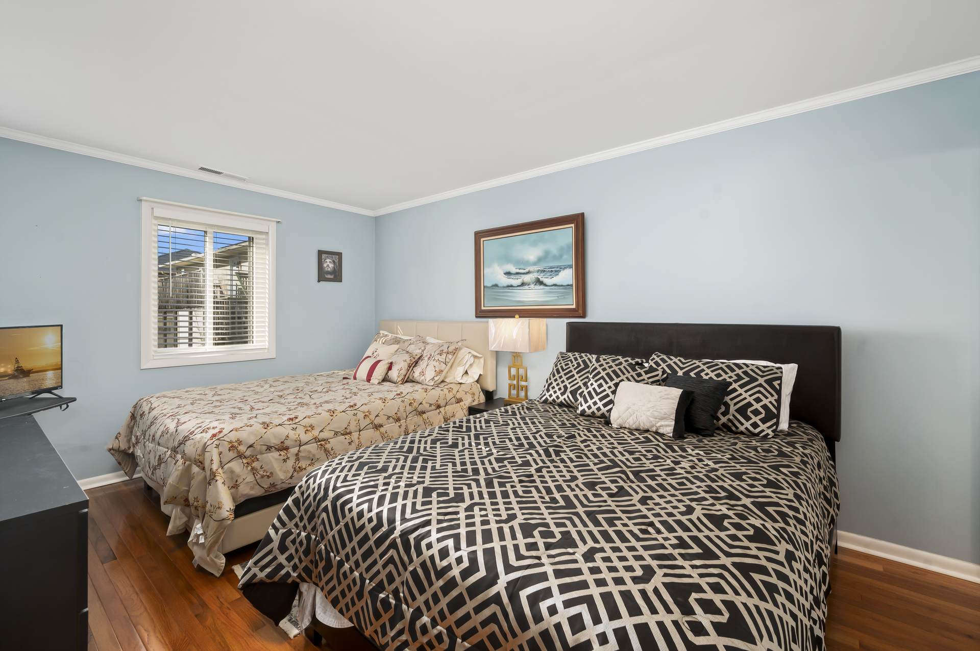 The Primary Bedroom sleeps 4 with 2 Cozy Queen Beds.