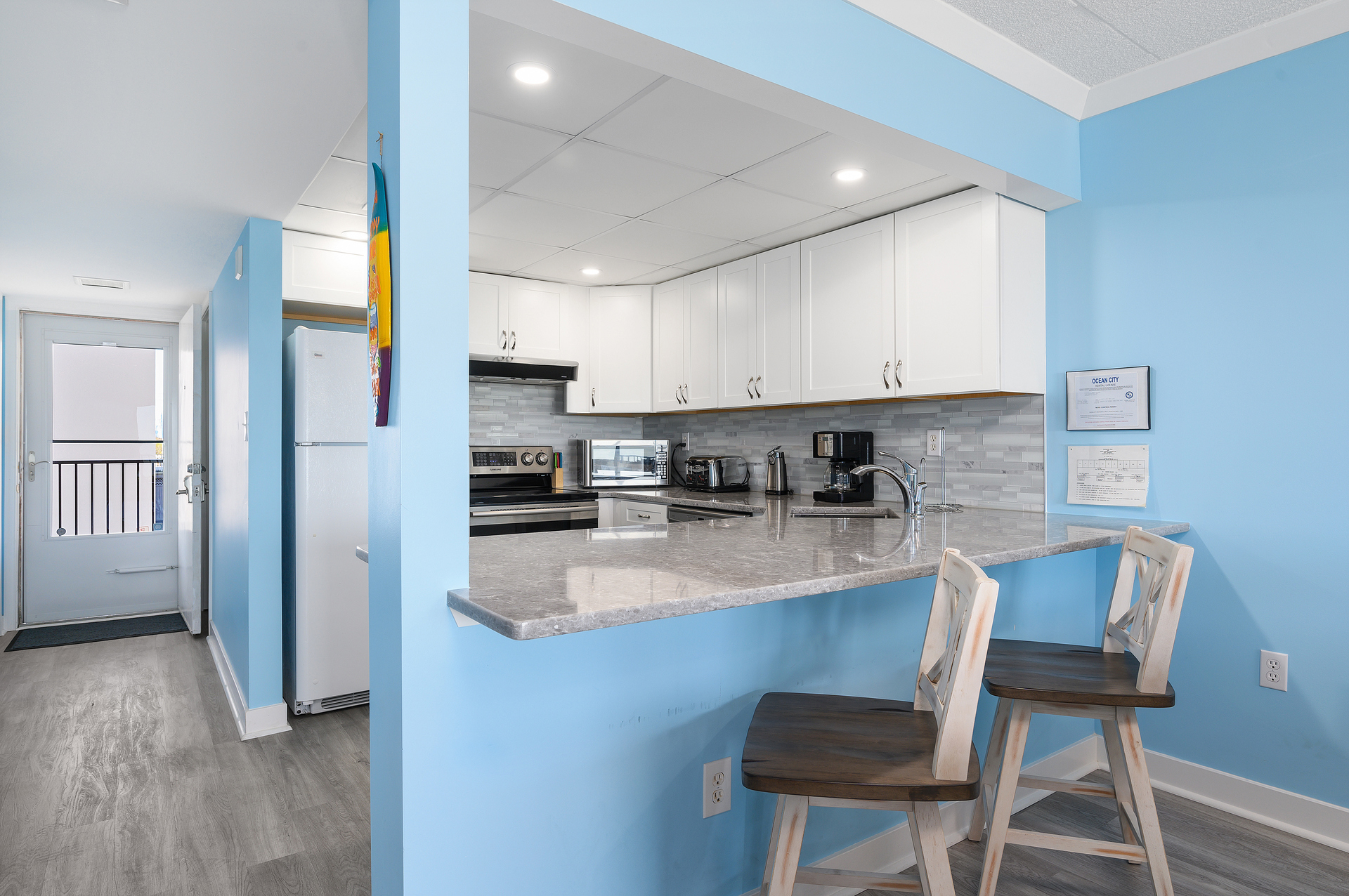 Bright white cabinets and lots of storage space.